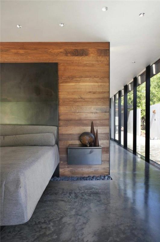 1-pekná-elegantná spálňa so sivou voskovanou betónovou podlahou a veľkými oknami