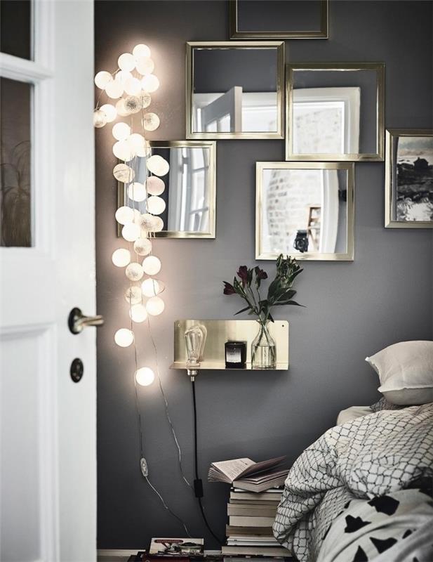 romantisk stämning i grå vägg sovrum med vit dörr och metallisk spegelvägg