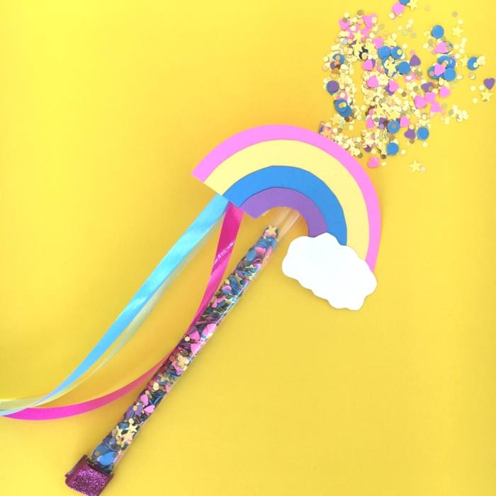 idé för en gästgåva med tema enhörning, en trollstav med regnbåge fylld med mångfärgade konfetti