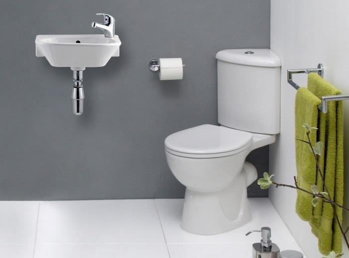 príklad rozloženia kúpeľne, jednoduché umývadlo, rohové WC a vešiak na uteráky, sivé a biele steny
