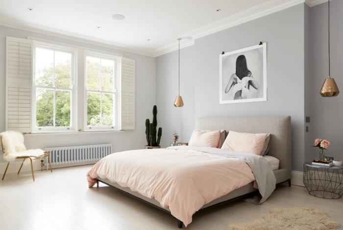 grå väggar apus i ett skandinaviskt sovrum, kokande deco -idé med vitt omslag av fuskpäls