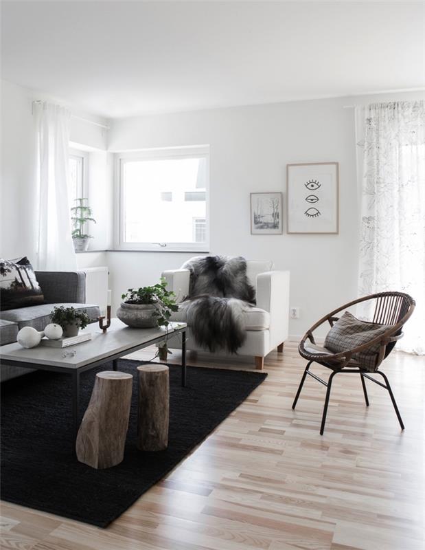 Skandinavisk vardagsrumsinredning i vitt och grått med trä accenter, raffinerad och mysig atmosfär i ett modernt nordiskt vardagsrum