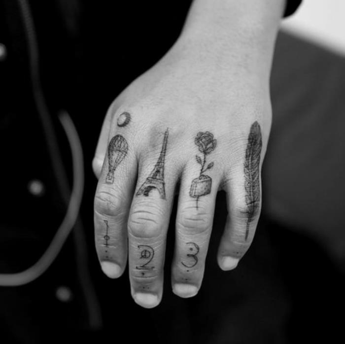 en annan tatuering på varje finger, en eklektisk manstatuering