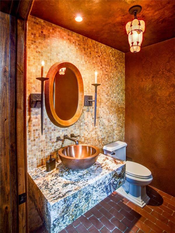 bagno-vintage-original-decorazioni-barrocche-parete-mosaico-illuminazione-soffusa-lavabo-appoggio