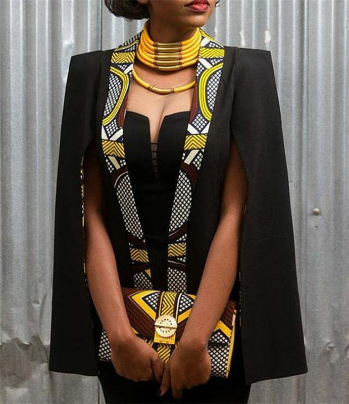 svart klänning och kavaj, stort gult halsband, afrikansk attraktion, mönstrad kopplingsväska