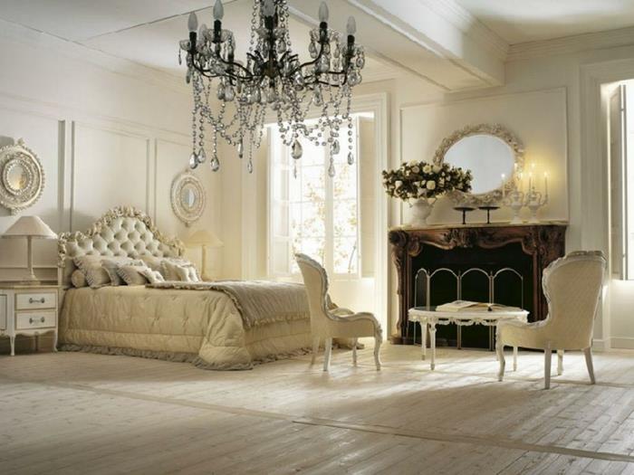 boudoir sovrum, vita väggar, vadderad sänggavel, vit sänglampa, laminatparkett