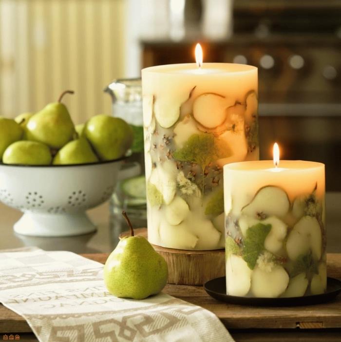 dekorativt ljus med fruktskivor kronblad gröna blad vegetabiliskt vaxljus utan behållare