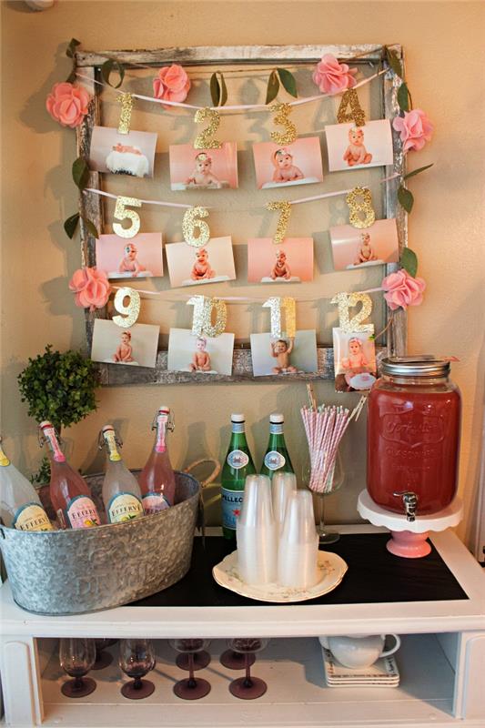 1 år gammal baby födelsedagsdekoration idé, återvunnet trä fotohållare dekorerad med ett papper ros krans som en väggdekoration för drink bar