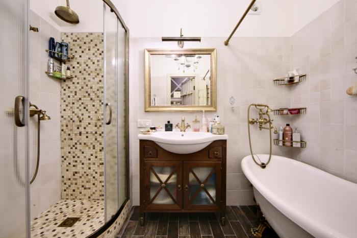 ovalt badkar, duschkabin, glasväggar, stort duschhuvud, fyrkantig spegel, underdel i trä, plankgolv