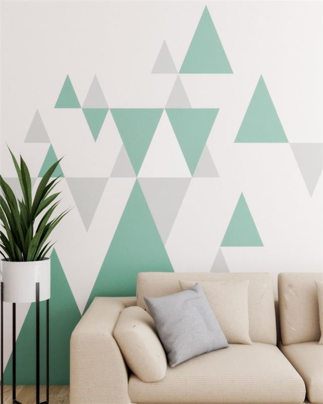 béžová sedačka geometrický obraz stena obývačka kvetina biele nohy kovové tvary maľba farba sivé odtiene zelená rastlina