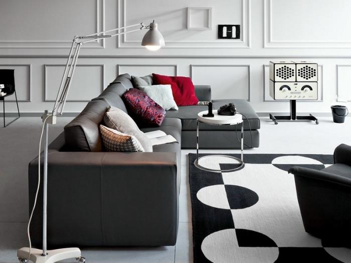 hur man kombinerar neutrala färger i ett modernt vardagsrum möblerat med mörka soffmöbler och vitt runt bord