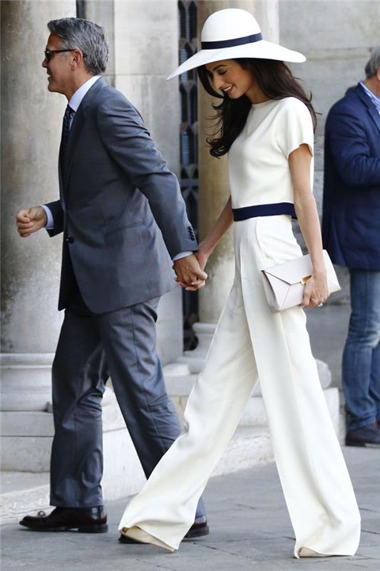 hur man klär sig för en kvinnceremoni, elegant outfit -modell i vitt och svart, vita kopplingstillbehör, formell kostym för kvinna