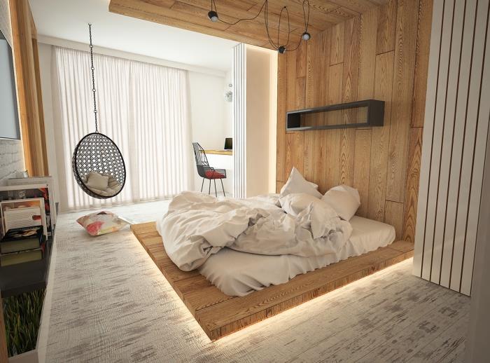 komplett vuxen sovrum i skandinavisk stil med låg säng och hängande stol för en kokande atmosfär
