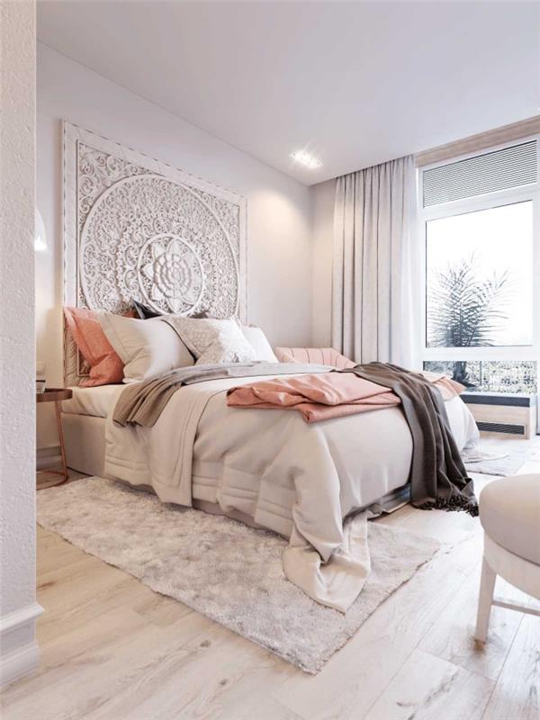 moderný interiérový dizajn v spálni pre dospelých s bielymi stenami s bielym a dreveným nábytkom, model postele v orientálnom štýle