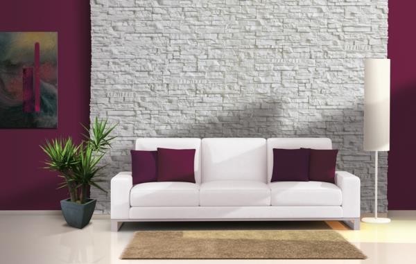 sovrum-i-lila-växt-soffa-kuddar-sten-vägg