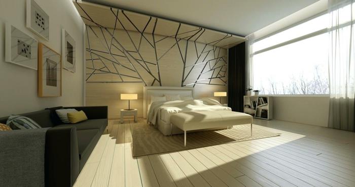 لون جدار غرفة النوم أبيض وبيج ، أنماط رسومية باللون الرمادي المعدني ، سرير أريكة بلون الشمبانيا ، لوحات مؤطرة