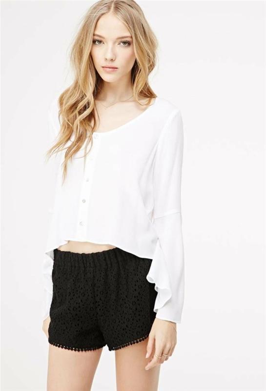 chic-and-elegant-with-black-flowing-shorts-woman-and-white-shirt