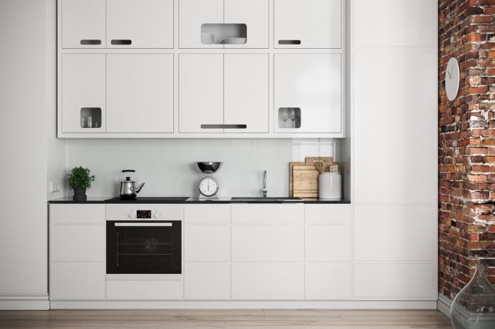 biela kuchynská dekorácia s nábytkom bez úchytiek a čierneho pultu, ukážka obkladu steny do kuchyne