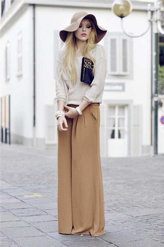 hur man klär sig, elegant kvinna klädstil, beige lösa byxor med blus och hatt i neutrala färger
