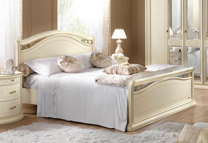 beige och vit färgkombination för inredningen i det moderna sovrummet med vintage designmöbler i beige och vitt