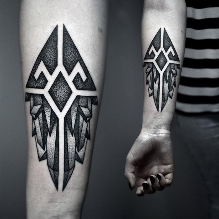 bodkované tetovanie s mužným dizajnom zobrazujúce rozložený kryštál