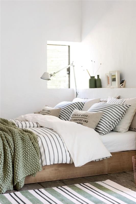 biela dekorácia spálne drevený nábytok rám postele farba dreva khaki zelená váza zelená