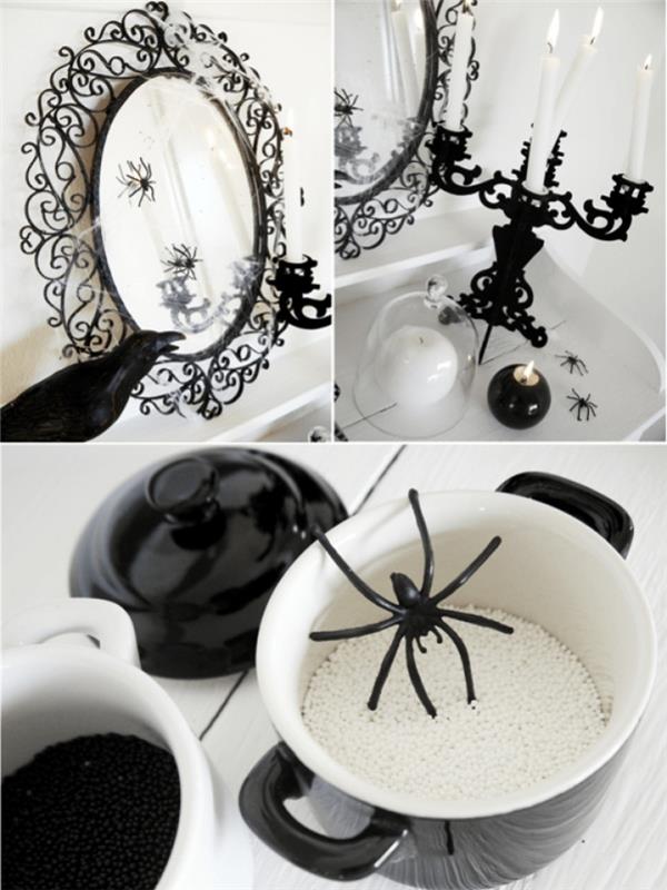 halloween dekoration i vitt och svart, oval spegel i barockstil med små dekorativa spindlar och vita och svarta ljushållare