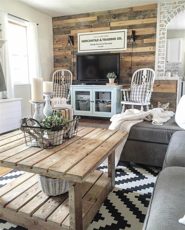 elegant lantlig inredning med rustika element, träbord, svartvitt matta, geometriska former, grå soffa, accentvägg i träplankor, dekorativ panel