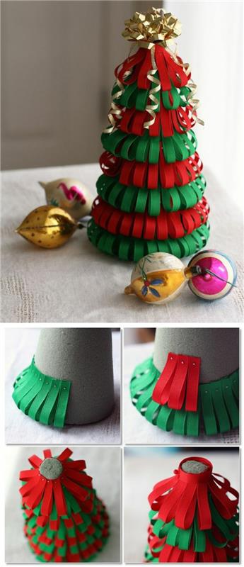 Vianočná ozdoba vlastnoručne urobená, vianočný stromček vyrobený na kartónovom kornútku, na ktorý sú nanesené malé pásiky farebného papiera v červenej a zelenej farbe, vrch ozdobený mašličkou na darčekové balenie v zlatej farbe