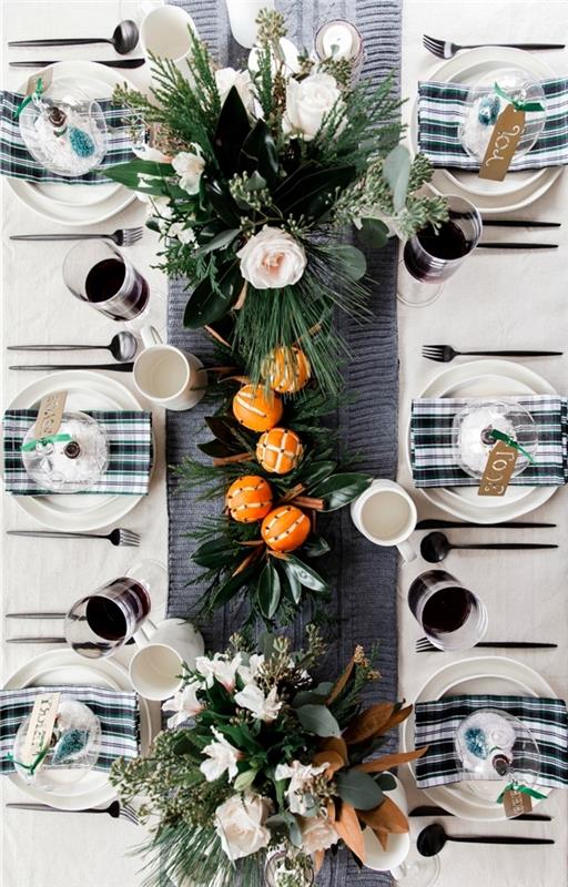 deco noel diy apelsinfrukter bukett konstgjorda blommor gröna bladverk vita ljus servettplattor