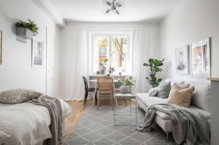 matsal, vardagsrum och sovrum i ett och samma rum, studentstudio i nordisk stil, grå och vit inredning