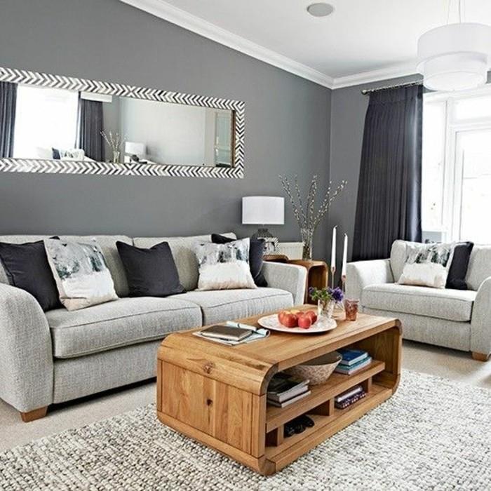 dekoratívny salón-moderná-farba-obývačka-tmavo-šedá-pohovka-svetlo-sivá-drevený-stolný-desing-zaujímavý