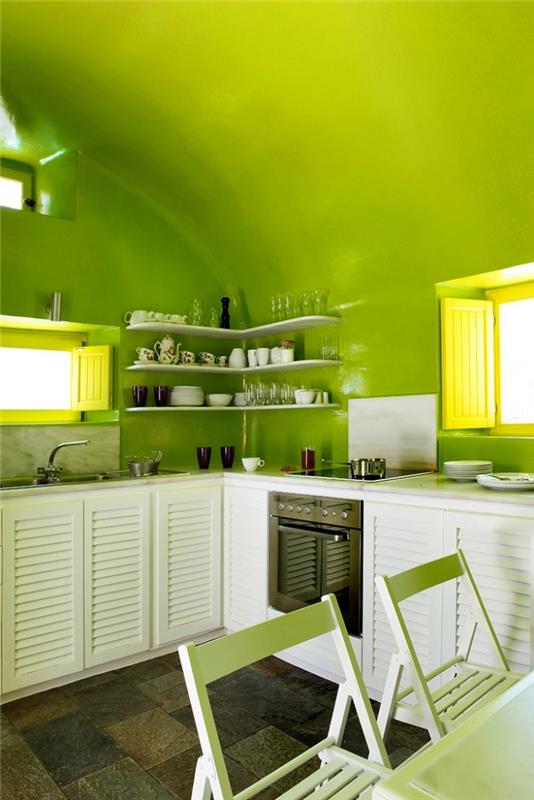 نموذج مطبخ بجدران مطلية باللون الأخضر اليانسون مجهز باللون L مع أثاث باللون الأبيض ، وأفكار لونية للمطبخ
