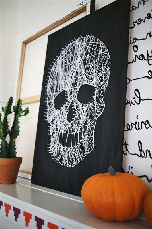 dekorativa föremål för Halloween, svart färg med skalle i vita trådar, träram i vit och svart