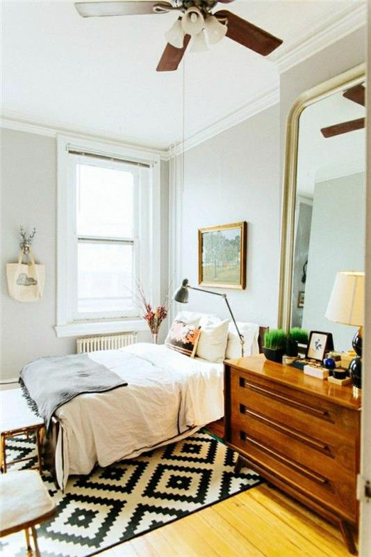 علاقة سرير-أبيض-أسود-غرفة نوم-باركيه-رمادي-حائط-نافذة-غرفة نوم-مليئة بالإضاءة
