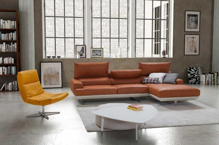 interiérový dizajn dekorácia priemyselný štýl obývačka biely konferenčný stolík terakotová sedačka súčasný štýl tmavá drevená knižnica rohová koža