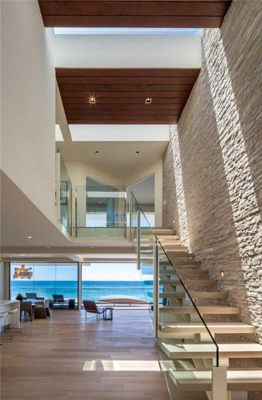 hängande-trappa-modern-villa-nära-havet-tegel-väggen