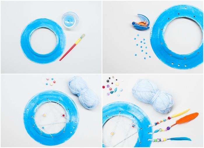 model lapača snov dieťa v papierovom tanieri prelakované na modro sieťou s bielou niťou, ozdobou z farebných korálikov a peria