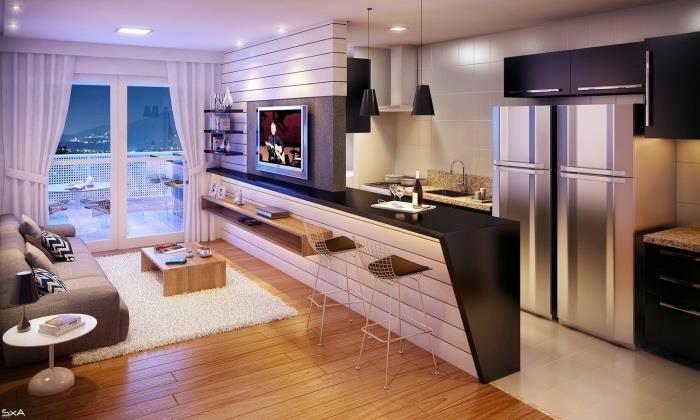 litet kök, vitt klinkergolv, grått kylskåp, svart köksskåp, en vit centralö med svart bänkskiva, grå soffa, vit matta och minimalistiskt soffbord i trä
