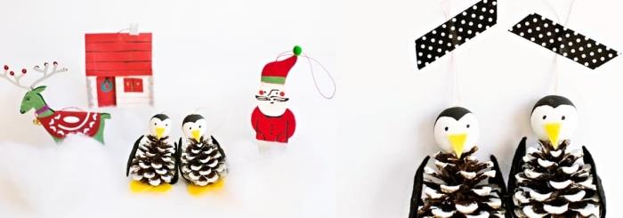hur man gör julprydnader, ett par diy pingviner gjorda av kottar att hänga på julgranen