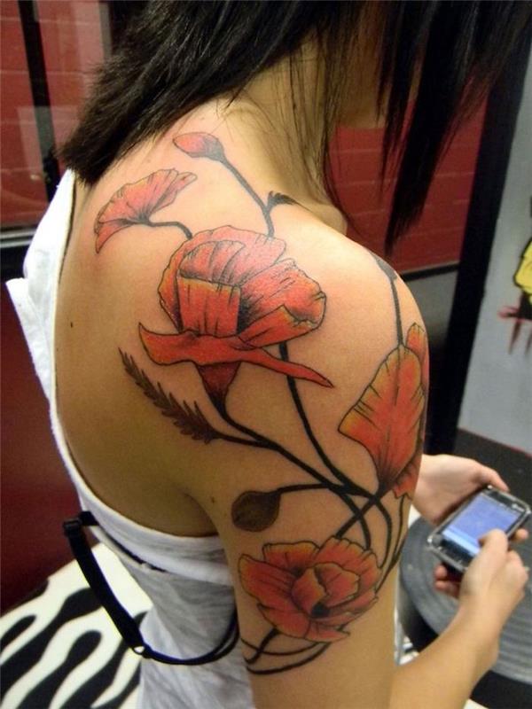Blomma tatuering på rygg och axel orange tatoo blomma kvinna vallmo