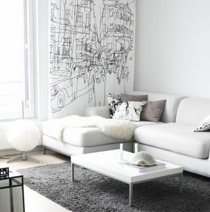 nádherná obývačka-sivá-a-biela-farba-obývačka-biela-sedačka-biely-koberec-sivá-stena-s-grafickými líniami