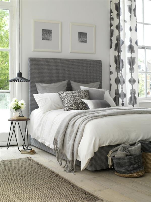 pärlgrå färg sovrum med vita och rökgrå gardiner och två målningar med vita ramar