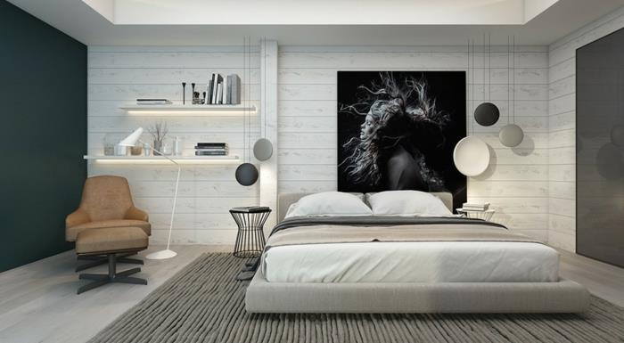 modern vuxen sovrum dekoration, grå matta, brun fåtölj, upplysta hyllor, svartvit fotografering