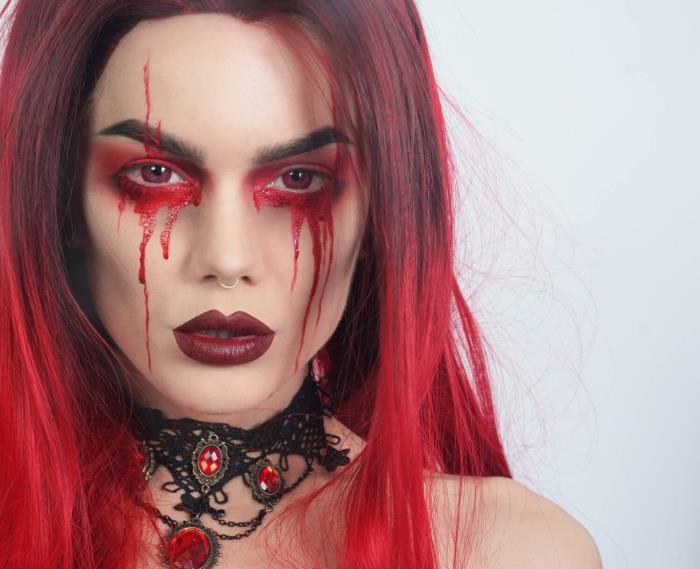 en gotisk demonmakeup med tårar av blod och vinrött läppstift, röd halo -effektmakeup