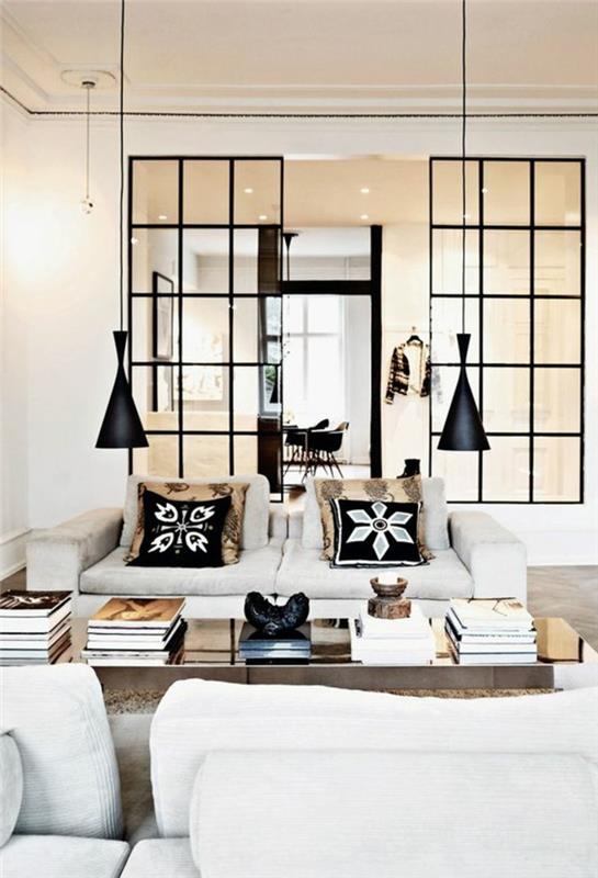 dizajnové lustre v čiernej farbe pre elegantnú obývaciu izbu s bielou pohovkou a drevenou obývacou izbou so stolom sivá