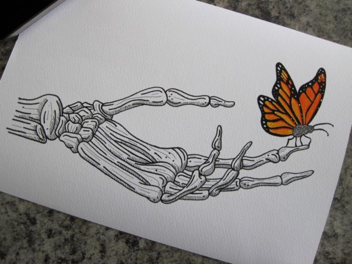 يد هيكل عظمي وفراشة على الإصبع كيفية رسم فراشة ، فكرة جميلة لتلوين الفراشة