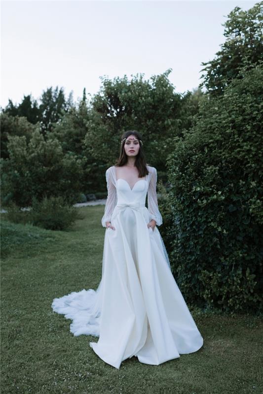 فكرة عن فستان زفاف أصلي ، مثال على خياطة فستان الزفاف مع فستان بدون حمالات بأكمام منتفخة