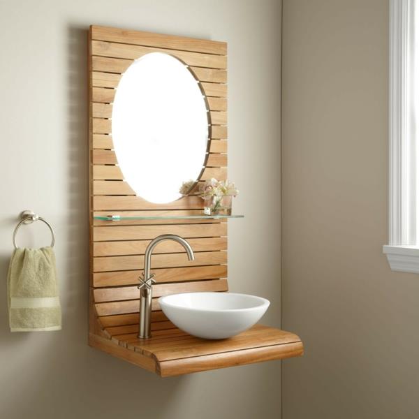 teaková kúpeľňová skrinka-malé-biele-umývadlo-a-okrúhle zrkadlo