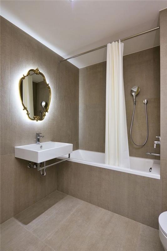 snygg inredningsmodell med vägg- och golvbeläggning i brun färg och utrustning i vit duschmodell med badkar